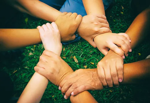 Photo of multicultural kids holding hands